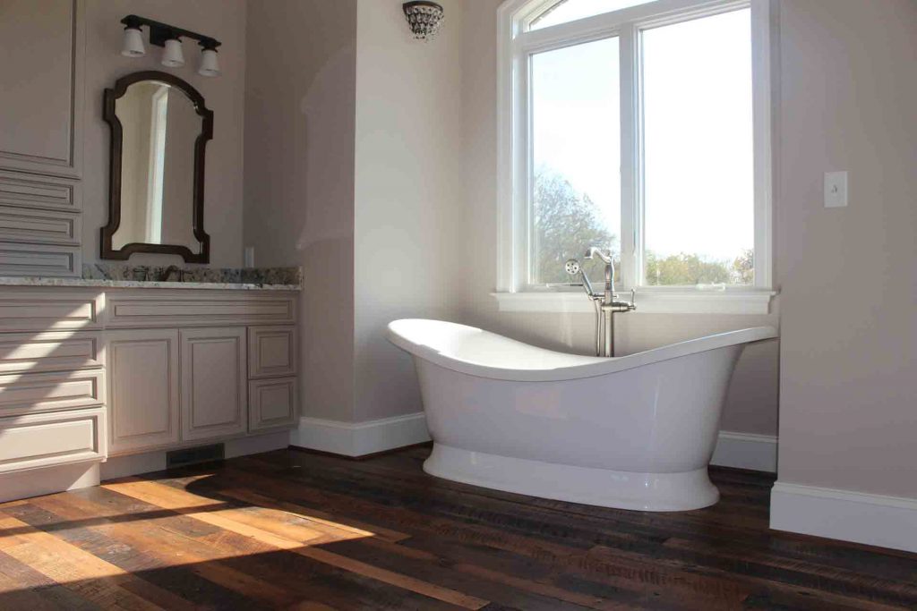 Warfield Homes rustic bathroom with Cochran's Lumber flooring